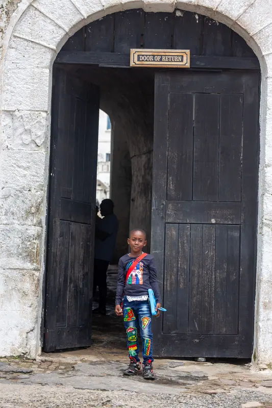 A pupil standing in the castle's Door of Return