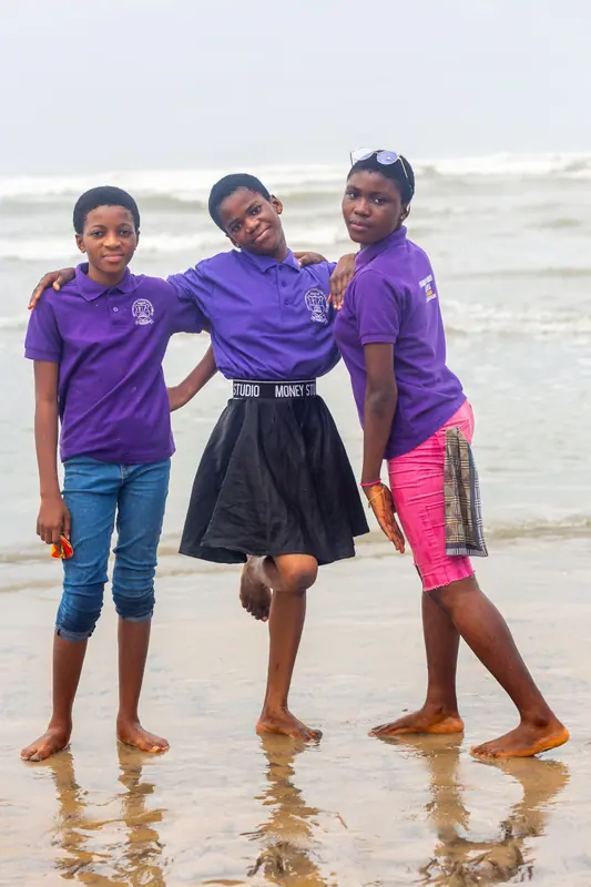 Three pupils together on the beach