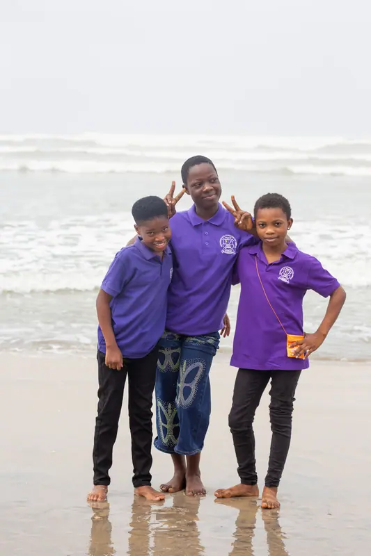 Three pupils on the beach