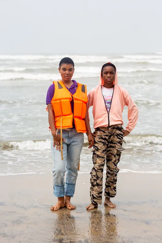 Two pupils in life jackets on the shore