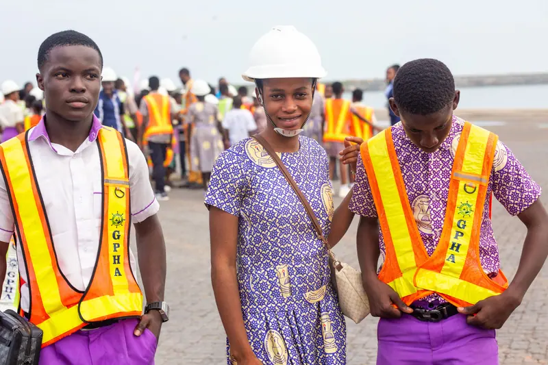Pupils and a member of staff in safety gear at the harbour