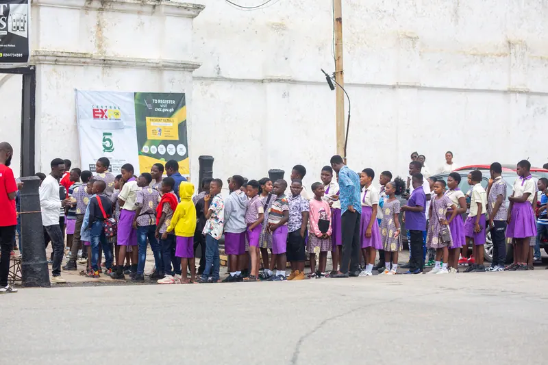 Pupils queueing along the wall at the castle entrance