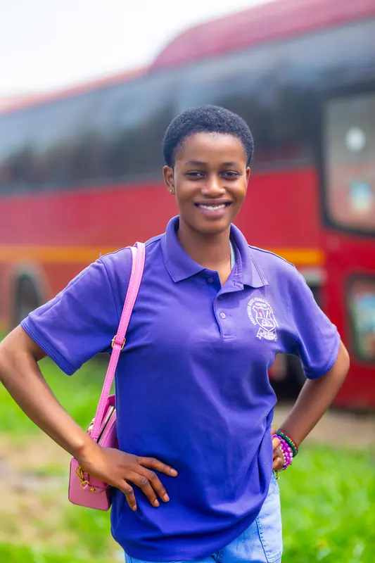 A member of staff in front of the coach