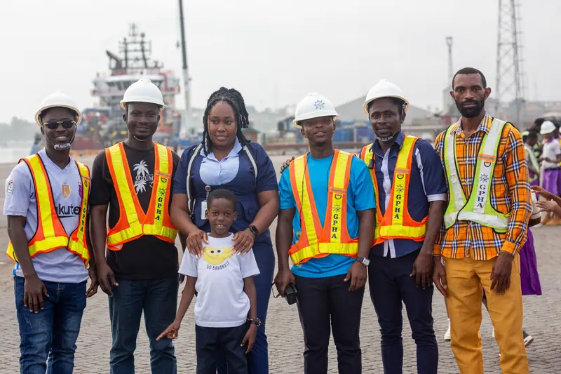 Staff in high-visibility vests at the harbour